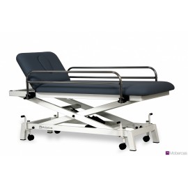 TABLE HYDRAULIQUE PÉDIATRIQUE AVEC BARRIÈRES, BOUCHON FACIAL ET ROULETTES RÉTRACTABLES