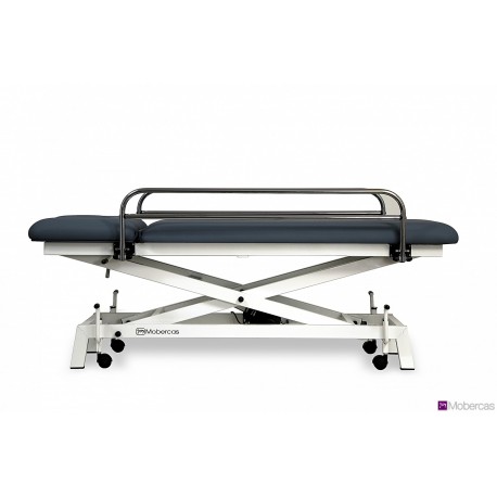 TABLE HYDRAULIQUE PÉDIATRIQUE AVEC BARRIÈRES, BOUCHON FACIAL ET ROULETTES RÉTRACTABLES