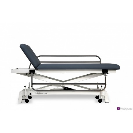 TABLE HYDRAULIQUE PÉDIATRIQUE AVEC BARRIÈRES, BOUCHON FACIAL ET ROULETTES RÉTRACTABLES