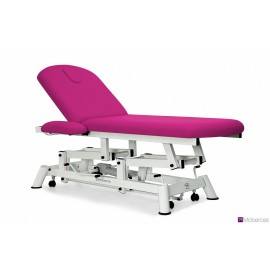 TABLE D'EXAMEN HYDRAULIQUE 2 PANNEAUX AVEC ACCOUDOIRS, PORTE-ROULEAUX, ROULETTES RÉTRACTABLES ET BOUCHON FACIAL