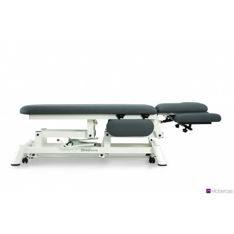 TABLE HYDRAULIQUE AVEC DOSSIER PROCLIVE / DÉCLIVE, ACCOUDOIRS, PORTE-ROULEAUX, BOUCHON FACIAL ET ROULETTES RÉTRACTABLES